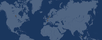 Stylized world map in blue tones illustrating global coverage and international reach, representing the company’s worldwide presence.