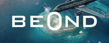 BeOnd aircraft flying above tropical islands and turquoise reefs, with large “BEOND” text overlay across the image.BeOnd aircraft flying above tropical islands and turquoise reefs, with large “BEOND” text overlay across the image.